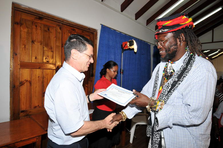 NGO member receives course certificate
