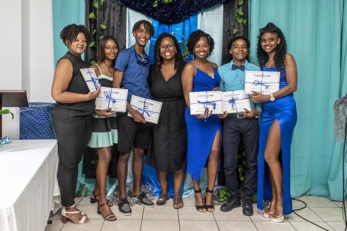 The six graduates with project coordinator Betty Mondon